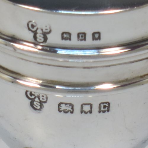 A handsome and unusual Antique Sterling Silver two-piece travelling communion set consisting of a chalice body for consecrated wine, together with lift-off pyx box with cover lid for host wafers. The lid with an applied urn-shaped finial, and the pyx body having a gold-gilt interior. Made by Charles Boyton and Sons of London in 1918. The dimensions of this fine hand-made antique silver travelling communion set are height 10 cms (4 inches), diameter of main body 4.5 cms (1.75 inches), and it weighs approx. 92g (3 troy ounces).  