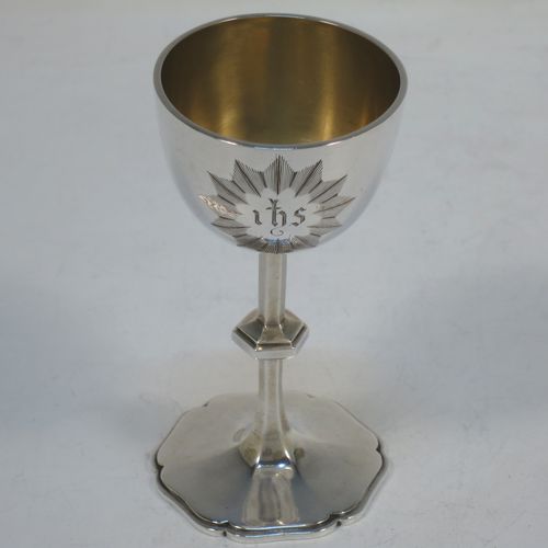 A handsome Antique Victorian Sterling Silver three-piece travelling communion set consisting of a chalice with gold-gilt interior, a paten with an applied shaped border, and a wine bottle with screw-off lid. The chalice and paten made by George Richards and Edward Brown of London in 1865, and the wine bottle by H. F. and Co. Ltd., of London in 1965. The dimensions of this fine antique silver travelling communion set are height of chalice 9 cms (3.5 inches), diameter of paten 7 cms (2.75 inches), height of wine bottle 10 cms (4 inches), with a total  weight of approx. 126g (4 troy ounces). Please note that the chalice and paten have hand engraved christograms. 