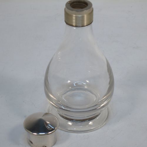 A handsome Antique Victorian Sterling Silver three-piece travelling communion set consisting of a chalice with gold-gilt interior, a paten with an applied shaped border, and a wine bottle with screw-off lid. The chalice and paten made by George Richards and Edward Brown of London in 1865, and the wine bottle by H. F. and Co. Ltd., of London in 1965. The dimensions of this fine antique silver travelling communion set are height of chalice 9 cms (3.5 inches), diameter of paten 7 cms (2.75 inches), height of wine bottle 10 cms (4 inches), with a total  weight of approx. 126g (4 troy ounces). Please note that the chalice and paten have hand engraved christograms. 