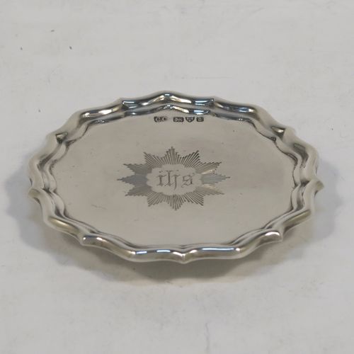 A very elegant Antique Edwardian Sterling Silver three-piece travelling communion set consisting of chalice, paten, and wine ewer. The chalice having a plain round bellied body, a gold-gilt interior, and sitting on a pedestal foot. The paten having a round body with an applied Chippendale border, and sitting on a pedestal foot. The wine ewer having a plain bellied body, a pull-off top with cork stopper and cruciform finial, a scroll side-handle, and sitting on a pedestal foot. All three pieces are hand-engraved with an IHS Christogram, and they are all sitting in their original dark blue satin and velvet-lined presentation box. This beautiful communion service was made by Charles Cook of Chester in 1905. The dimensions of this fine hand-made antique silver travelling communion set are height of chalice 8.5 cms (3.3 inches), diameter of paten 7 cms (2.75 inches), height of wine ewer 11 cms (4.25 inches), and with a total weight of approx. 160g (5.2 troy ounces). Please note that the paten has a contemporaneous presentation inscription underneath-to be removed.