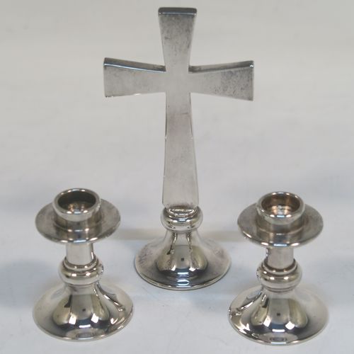 An unusual Silver Plated communion set consisting of two small candlesticks and an altar cross, all in their original dark blue velvet-lined presentation box. All three pieces are hand-made cast and then silver-plated so very durable, and made in the 1950s. The dimensions of this fine hand-made silver-plated travelling communion set are height of altar cross 10 cms (4 inches), diameter of candlesticks 3.5 cms (1.3 inches).   