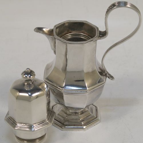 A very elegant and unusual Antique Sterling Silver small travelling communion wine flagon or ewer, having a plain octagonal panelled body, with a reeded scroll handle, a sparrow-beak spout, a screw-in matching lid with cast finial, and all sitting on a pedestal foot. This handsome silver travelling communion wine ewer or flagon was made by Charles Boyton and Sons of Sheffield in 1913. The dimensions of this fine hand-made antique silver travelling communion wine ewer are height 11 cms (4.25 inches), length 7 cms (2.75 inches), and it weighs approx. 119g (3.8 troy ounces).