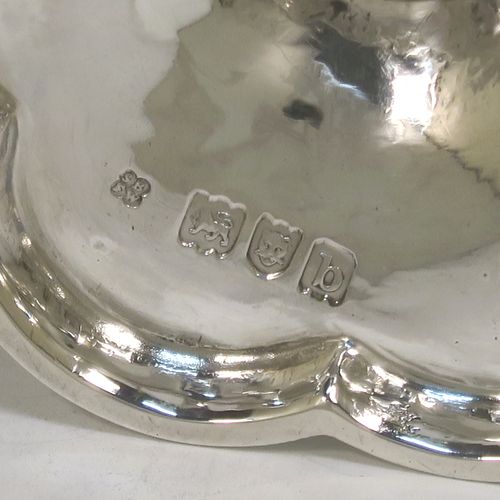 An elegant Antique Victorian Sterling Silver small travelling communion chalice, having a plain round tapering cup, a middle plain round baluster, and sitting on a hexafoil pedestal foot. This beautiful antique silver chalice was made by Blunt and Wray of London in 1897. The dimensions of this fine hand-made silver chalice are height 9 cms (3.5 inches), diameter of cup 5 cms (2 inches), and a weight of approx. 86g (2.8 troy ounces). Please note that this item is engraved with the Latin inscription Poculum Caritatis which stands for The Cup of Kindness.