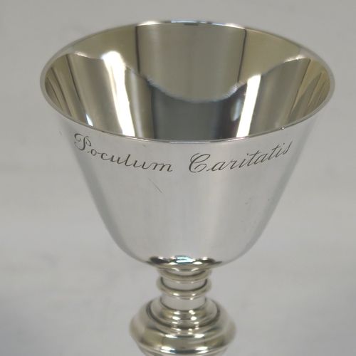 An elegant Antique Victorian Sterling Silver small travelling communion chalice, having a plain round tapering cup, a middle plain round baluster, and sitting on a hexafoil pedestal foot. This beautiful antique silver chalice was made by Blunt and Wray of London in 1897. The dimensions of this fine hand-made silver chalice are height 9 cms (3.5 inches), diameter of cup 5 cms (2 inches), and a weight of approx. 86g (2.8 troy ounces). Please note that this item is engraved with the Latin inscription Poculum Caritatis which stands for The Cup of Kindness.