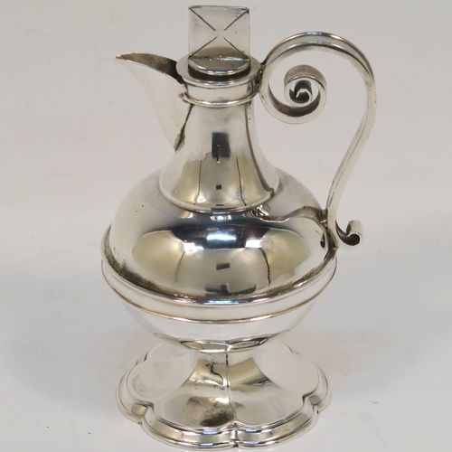 A very handsome Antique Victorian Sterling Silver three-piece travelling communion set consisting of chalice, paten, and wine ewer. The chalice having a plain round bellied body with a hexagonal stem and shaped round pedestal foot. The paten having a round body with an applied reeded border, and sitting on a flat base. The wine ewer having a plain bellied body, a pull-off top with cork stopper and cruciform finial, a scroll side-handle, and sitting on a matching pedestal foot. All three pieces are hand-engraved with an IHS Christogram, and they are all sitting in their original dark blue velvet-lined presentation box which has a contemporaneous presentation inscription on a brass plaque. This beautiful communion service was all made by Walker and Hall of Sheffield in 1896. The dimensions of this fine hand-made antique silver travelling communion set are height of chalice 9 cms (3.5 inches), diameter of paten 8.5 cms (3.3 inches), height of wine ewer 10.5 cms (4 inches), and with a total weight of approx. 238g (7.7 troy ounces).