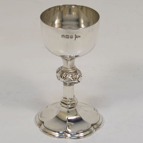 A very handsome Antique Victorian Sterling Silver three-piece travelling communion set consisting of chalice, paten, and wine ewer. The chalice having a plain round bellied body with a hexagonal stem and shaped round pedestal foot. The paten having a round body with an applied reeded border, and sitting on a flat base. The wine ewer having a plain bellied body, a pull-off top with cork stopper and cruciform finial, a scroll side-handle, and sitting on a matching pedestal foot. All three pieces are hand-engraved with an IHS Christogram, and they are all sitting in their original dark blue velvet-lined presentation box which has a contemporaneous presentation inscription on a brass plaque. This beautiful communion service was all made by Walker and Hall of Sheffield in 1896. The dimensions of this fine hand-made antique silver travelling communion set are height of chalice 9 cms (3.5 inches), diameter of paten 8.5 cms (3.3 inches), height of wine ewer 10.5 cms (4 inches), and with a total weight of approx. 238g (7.7 troy ounces).