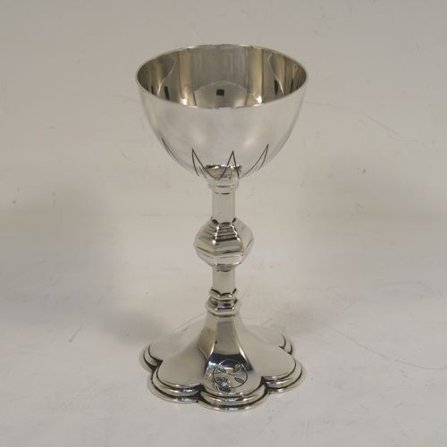 A handsome Antique Sterling Silver small travelling communion chalice, having a plain round tapering cup, a middle hexagonal baluster, and sitting on a hexafoil pedestal foot. This beautiful antique silver chalice was made in London in 1919. The dimensions of this fine hand-made silver chalice are height 10 cms (4 inches), diameter of cup 5 cms (2 inches), and a weight of approx. 78g (2.5 troy ounces).   