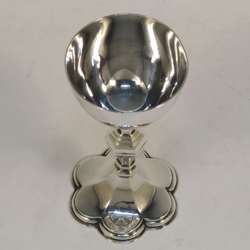 A handsome Antique Sterling Silver small travelling communion chalice, having a plain round tapering cup, a middle hexagonal baluster, and sitting on a hexafoil pedestal foot. This beautiful antique silver chalice was made in London in 1919. The dimensions of this fine hand-made silver chalice are height 10 cms (4 inches), diameter of cup 5 cms (2 inches), and a weight of approx. 78g (2.5 troy ounces).   