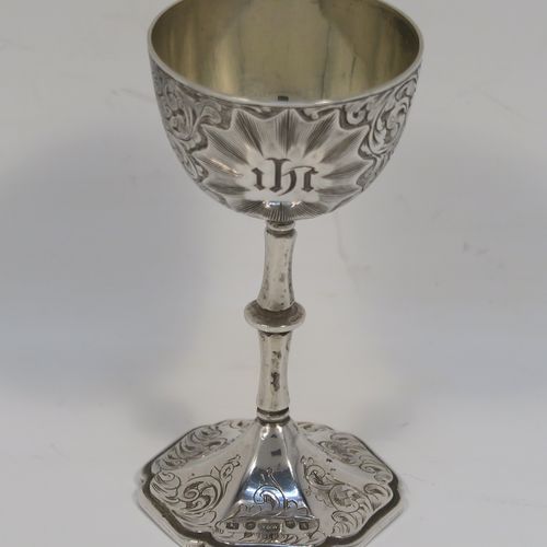 A beautiful Antique Victorian Sterling Silver three-piece travelling communion set consisting of chalice, paten, and wine flagon. In a round bellied style, having the remains of a gold-gilt interior to the chalice, an amphora style flagon, and a paten with an applied border and pedestal foot, all over hand-engraved with floral and scroll decoration. This very pretty silver communion set was made by Yapp and Woodward of Birmingham in 1849. The dimensions of this fine hand-made antique silver travelling communion set are height of flagon 9 cms (3.5 inches), diameter of paten 6.5 cms (2.5 inches), and with a total weight of approx. 129g (4 troy ounces). Please note that all items are engraved with a Christogram, and the paten and chalice are engraved with contemporaneous sets of initials.   