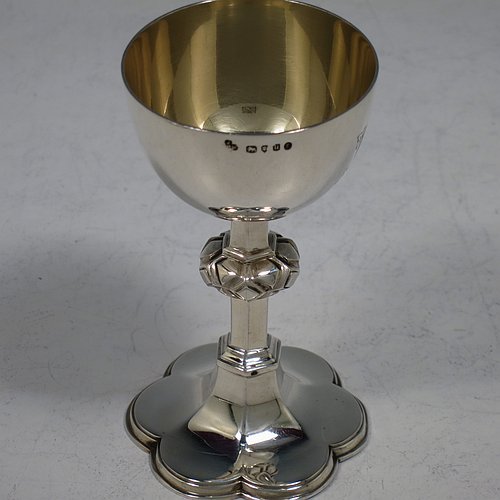 An Antique Victorian Sterling Silver small travelling communion chalice and paten, the chalice having a plain round cup with gold-gilt interior, a central cast baluster, and sitting on a hexafoil pedestal foot. The paten having a plain round body with hand-chased hexafoil ground and an applied rim. Made by the Barnard Brothers of London in 1875 (chalice) and 1878 (paten). The dimensions of this fine hand-made antique silver travelling communion set are height of chalice 9 cms (3.5 inches), diameter of paten 7.5 cms (3 inches), with a total weight of approx. 85g (2.7 troy ounces). Please note that both the chalice and paten are engraved with a Christogram.