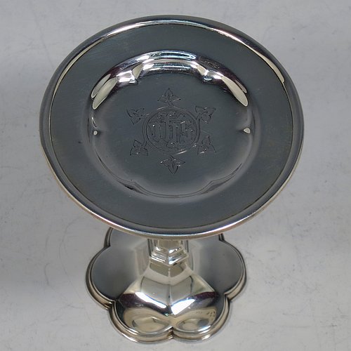 An Antique Victorian Sterling Silver small travelling communion chalice and paten, the chalice having a plain round cup with gold-gilt interior, a central cast baluster, and sitting on a hexafoil pedestal foot. The paten having a plain round body with hand-chased hexafoil ground and an applied rim. Made by the Barnard Brothers of London in 1875 (chalice) and 1878 (paten). The dimensions of this fine hand-made antique silver travelling communion set are height of chalice 9 cms (3.5 inches), diameter of paten 7.5 cms (3 inches), with a total weight of approx. 85g (2.7 troy ounces). Please note that both the chalice and paten are engraved with a Christogram.