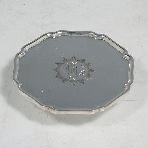 A Sterling Silver four-piece travelling communion set consisting of chalice, paten, spoon, and wine bottle. The chalice having a plain round body, a gold-gilt interior, and sitting on a hexagonal pedestal foot. The paten having a hexagonal body with an applied shaped border, and sitting on a collet foot. The wine bottle having a plain round screw-off lid, a cork seal, and the glass body with hand-cut panelled decoration. The anointing spoon having a plain oval bowl and ball finial. Both the chalice and paten are engraved with a Christogram. All sitting in its original purple satin and velvet-lined presentation box. Made by A. R. Mowbray & Co. Ltd., of London in 1930. The dimensions of this fine hand-made silver travelling communion set are height of chalice 8 cms (3.25 inches), diameter of paten 5.5 cms (2.25 inches), length of spoon 10 cms (4 inches), and with a total weight of approx. 125g (4 troy ounces).    