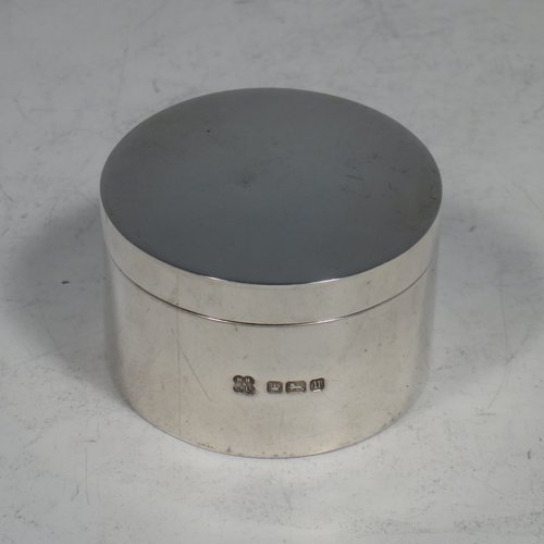 An Antique Sterling Silver four-piece travelling communion set consisting of chalice, paten, wine flagon, and pyx box. In a very plain round style, having a gold-gilt interior to the chalice, a pull-off lid with cork on the flagon, and a pull-off lid for the pyx box. All the pieces sit in their original blue velvet-lined presentation box which has an applied inscription attached to the top of the lid. Made by Martin Hall & Co., of Sheffield in 1912. The dimensions of this fine hand-made antique silver travelling communion set are height of flagon 13 cms (5 inches), diameter of paten 9 cms (3.5 inches), and with a total weight of approx. 254g (8.2 troy ounces).   
