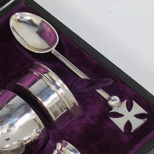 A complete Antique Sterling Silver six-piece travelling communion set consisting of chalice, paten, water, and wine bottles, a wafer pyx box, and an anointing spoon. The chalice having a plain round body with gold-gilt interior, and sitting on a round pedestal foot. The paten and pyx box having plain round bodies. The wine and water bottles having plain round screw-off lids, cork seals, and hand-cut crystal bodies. All hand-engraved with Christograms and sitting in their original purple satin and velvet-lined presentation box. All made by Frederick Dendy Wray of London in 1913. The dimensions of this fine hand-made antique silver travelling communion set are height of chalice 8.5 cms (3.3 inches), diameter of paten 5.5 cms (2.25 inches), and with a total weight of approx. 125g (4 troy ounces). Please note that the box lid exterior is monogrammed with a set of contemporaneous initials.