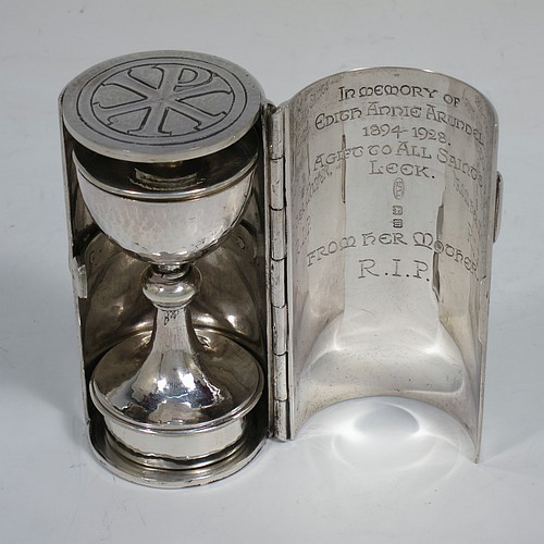 A lovely Arts and Crafts style Sterling Silver travelling communion set with hand-hammered decoration, consisting of a chalice with pull-off lid and gold-gilt interior, the lid also acting as a paten, a pyx box with hinged lid and gold-gilt interior, all fitted into an original silver cannister style hinged holder with a push-button latch and an applied Christogram on top. Made by Greenwood and Watts of London in 1927. The dimensions of this fine hand-made silver travelling communion set are length of cannister 8.5 cms (3.25 inches), height of chalice with lid 6.5 cms (2.5 inches), diameter of pyx box 3.5 cms (1.3 inches), with a total weight of approx. 212g (6.8 troy ounces). Please note that this item has an In Memorium inscription engraved on the inside of the cannister.