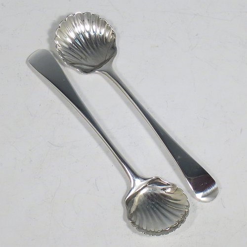 A rare Antique 18th Century Georgian Sterling Silver pair of salt spoons, in the Old English pattern, having hand-chased shell bowls. All made by Richard Crossley of London in 1788. The dimensions of these fine hand-made antique silver salt spoons are length 10 cms (4 inches), and they weigh a total of approx. 38g (1.5 troy ounces).