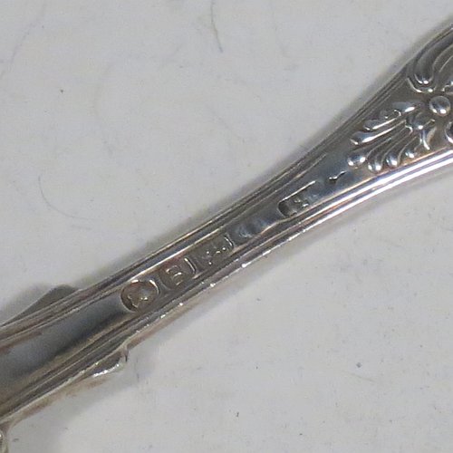An Antique Georgian Sterling Silver pair of salt spoons, in the double-struck Kings pattern, having gold-gilt bowls. All made by William Traies of London in 1827. The dimensions of these fine hand-made antique silver salt spoons are length 11 cms (4.25 inches), and they weigh a total of approx. 90g (3 troy ounces). Please note that these salt spoons are crested.