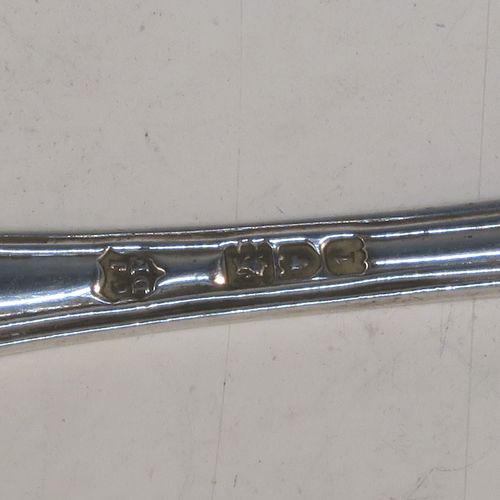 A very elegant and quite large Antique Edwardian Sterling Silver pair of salt spoons, in the double-struck Kings pattern, having gold-gilt bowls. All made by Jackson and Fullerton of London in 1906. The dimensions of these fine hand-made antique silver salt spoons are length 11.5 cms (4.5 inches), and they weigh a total of approx. 42g (1.4 troy ounces).