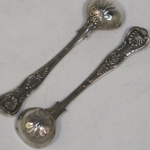 A very elegant and quite large Antique Edwardian Sterling Silver pair of salt spoons, in the double-struck Kings pattern, having gold-gilt bowls. All made by Jackson and Fullerton of London in 1906. The dimensions of these fine hand-made antique silver salt spoons are length 11.5 cms (4.5 inches), and they weigh a total of approx. 42g (1.4 troy ounces).