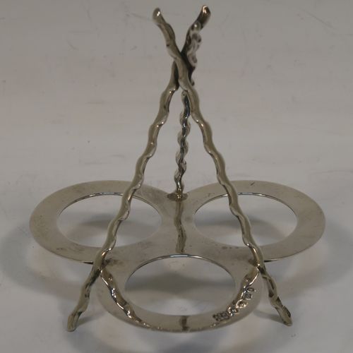 A very pretty and unusual Antique Victorian Sterling Silver Campfire style condiment set, consisting of a pepper shaker, mustard pot, and open salt with panelled cystal bodies and silver tops, all sitting in a campfire style frame with three tree branches joined together. This beautiful antique silver and crystal condiment set was made by Heath and Middleton of Birmingham in 1889. The dimensions of this fine hand-made antique silver condiment set are height 10 cms (4 inches), width 10 cms (4 inches), and it weighs approx. 70g (2.3 troy ounces).