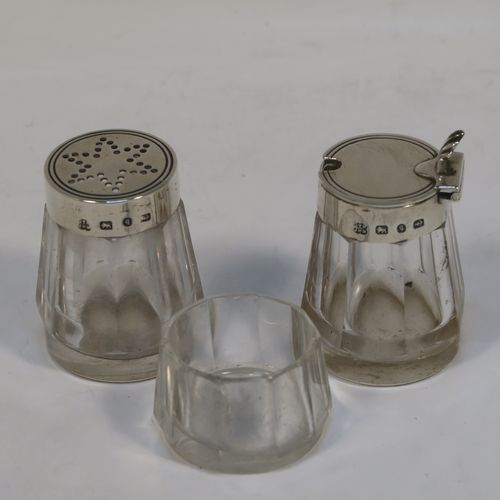 A very pretty and unusual Antique Victorian Sterling Silver Campfire style condiment set, consisting of a pepper shaker, mustard pot, and open salt with panelled cystal bodies and silver tops, all sitting in a campfire style frame with three tree branches joined together. This beautiful antique silver and crystal condiment set was made by Heath and Middleton of Birmingham in 1889. The dimensions of this fine hand-made antique silver condiment set are height 10 cms (4 inches), width 10 cms (4 inches), and it weighs approx. 70g (2.3 troy ounces).