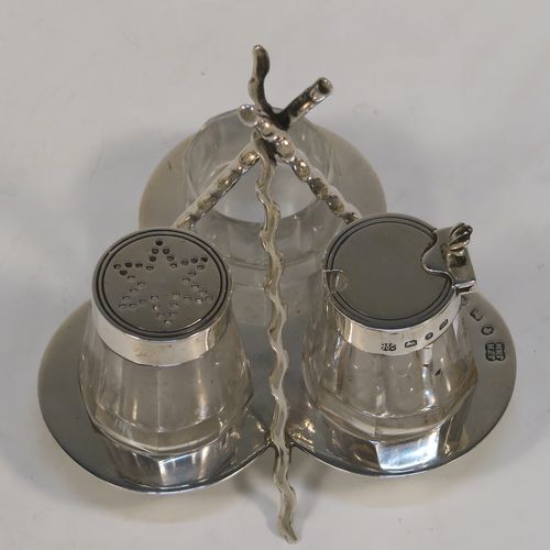 A very pretty and unusual Antique Victorian Sterling Silver Campfire style condiment set, consisting of a pepper shaker, mustard pot, and open salt with panelled cystal bodies and silver tops, all sitting in a campfire style frame with three tree branches joined together. This beautiful antique silver and crystal condiment set was made by Heath and Middleton of Birmingham in 1889. The dimensions of this fine hand-made antique silver condiment set are height 10 cms (4 inches), width 10 cms (4 inches), and it weighs approx. 70g (2.3 troy ounces).