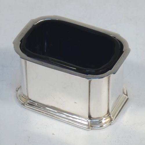 A very elegant Sterling Silver three-piece condiment set in an Art Deco style with straight-sided panelled bodies, consisting of an open salt cellar with a blue glass liner, a pepper pot with pull-off lid, a mustard pot with blue glass liner and hinged lid, together with two condiment spoons, and all in their cream satin and black velvet-lined presentation box. All made by Selfridges and Co., of Birmingham in 1939, apart from the spoons which are hallmarked for Birmingham in 1972. The dimensions of this fine hand-made silver condiment service are length of mustard pot 7 cms (2.75 inches), height of pepper pot 7.5 cms (3 inches), length of salt cellar 5 cms (3 inches), and with a total weight of approx. 118g (3.8 troy ounces).