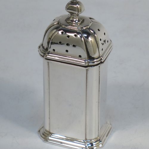 A very elegant Sterling Silver three-piece condiment set in an Art Deco style with straight-sided panelled bodies, consisting of an open salt cellar with a blue glass liner, a pepper pot with pull-off lid, a mustard pot with blue glass liner and hinged lid, together with two condiment spoons, and all in their cream satin and black velvet-lined presentation box. All made by Selfridges and Co., of Birmingham in 1939, apart from the spoons which are hallmarked for Birmingham in 1972. The dimensions of this fine hand-made silver condiment service are length of mustard pot 7 cms (2.75 inches), height of pepper pot 7.5 cms (3 inches), length of salt cellar 5 cms (3 inches), and with a total weight of approx. 118g (3.8 troy ounces).