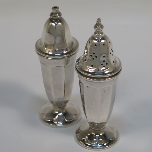 A handsome pair of Sterling Silver salt and pepper shakers, in a panelled Art Deco style, with pull-off lids and sitting on pedestal feet. These elegant silver salt and pepper pots were made by Emile Viner of Sheffield in 1938. The dimensions of this fine hand-made pair of silver pepper and salt shaker pots are height 10 cms (4 inches), diameter of main bodies 3.5 cms (1.3 inches), and the total weight is approx. 94g (3 troy ounces).  