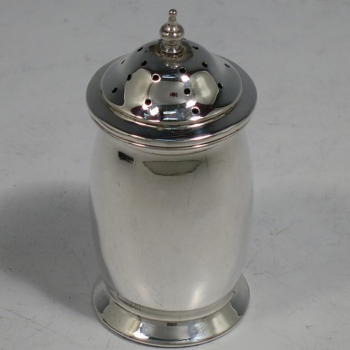 A Sterling Silver three-piece condiment set, in a very plain round bellied style, and consisting of two condiment spoons, a pepper pot, open salt cellar, and covered mustard pot, the latter two items with original blue glass liners, and all in their original cream satin and black velvet-lined presentation box. Made by Israel Sigmund Greenberg of Birmingham in 1939. The dimensions of this fine hand-made silver condiment service are height of pepper pot 7 cms (2.75 inches), length of mustard pot 7 cms (2.75 inches), and the total weight is approx. 88g (2.8 troy ounces).    