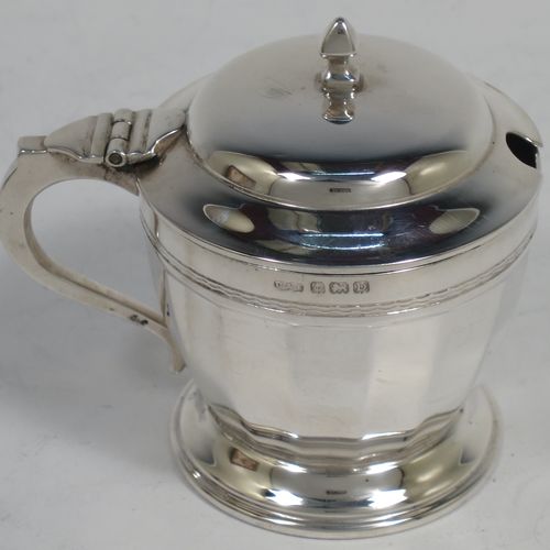 A very stylish Sterling Silver Art Deco five-piece condiment service in a plain round panelled style, consisting of a covered mustard pot with blue-glass liner, two open salts with blue-glass liners, two pepper shakers with pull-off lids, and three condiment spoons, all in their cream satin & black velvet-lined presentation box. Made by Deakin and Francis of Birmingham in 1928. The dimensions of this fine hand-made silver condiment service are height of peppers 8 cms (3.25 inches), length of mustard pot 7 cms (2.75 inches), with a total weight of approx. 281g (9 troy ounces).