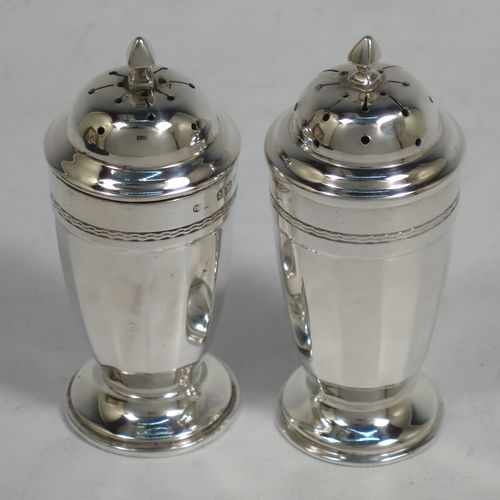 A very stylish Sterling Silver Art Deco five-piece condiment service in a plain round panelled style, consisting of a covered mustard pot with blue-glass liner, two open salts with blue-glass liners, two pepper shakers with pull-off lids, and three condiment spoons, all in their cream satin & black velvet-lined presentation box. Made by Deakin and Francis of Birmingham in 1928. The dimensions of this fine hand-made silver condiment service are height of peppers 8 cms (3.25 inches), length of mustard pot 7 cms (2.75 inches), with a total weight of approx. 281g (9 troy ounces).