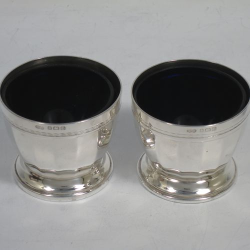A very stylish Sterling Silver Art Deco five-piece condiment service in a plain round panelled style, consisting of a covered mustard pot with blue-glass liner, two open salts with blue-glass liners, two pepper shakers with pull-off lids, and three condiment spoons, all in their cream satin & black velvet-lined presentation box. Made by Deakin and Francis of Birmingham in 1928. The dimensions of this fine hand-made silver condiment service are height of peppers 8 cms (3.25 inches), length of mustard pot 7 cms (2.75 inches), with a total weight of approx. 281g (9 troy ounces).
