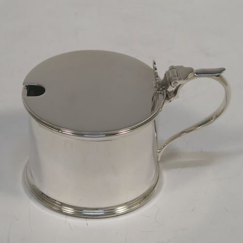 A very handsome Sterling Silver six-piece condiment set, in a very plain round Georgian style with applied reeded borders, and consisting of two pepper pots, two open salt cellars with blue-glass liners, and two covered mustard pots with hinged lids and blue-glass liners, together with two salt spoons and two mustard spoons, and all in their original cream satin and black velvet-lined presentation box. This beautiful silver condiment service was made by S. Blankensee and Sons of Chester and Birmingham in 1939. The dimensions of this fine hand-made silver condiment set are height of pepper pot 7 cms (2.75 inches), length of mustard pot 8 cms (3 inches), and the total weight is approx. 268g (8.6 troy ounces).