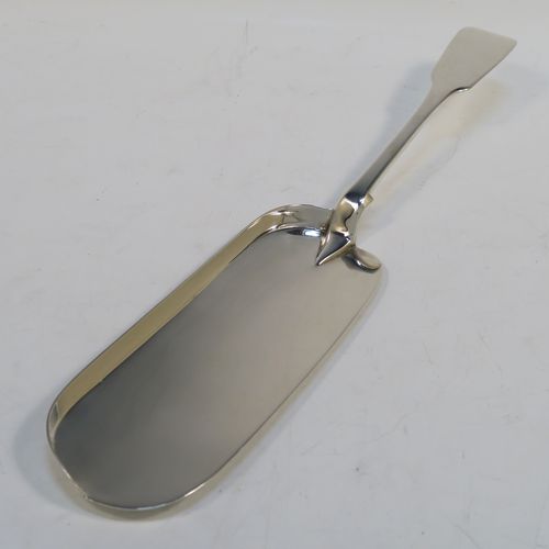A rare and very elegant Antique Victorian Sterling Silver crumb scoop in the Fiddle pattern, having a very plain blade. This handsome silver crumb scoop was made by the most important Victorian cutlery maker, George Adams of London in 1851. The dimensions of this fine hand-made silver crumb scoop are length 32 cms (12.5 troy ounces), and it weighs approx. 226g (7.3 troy ounces).