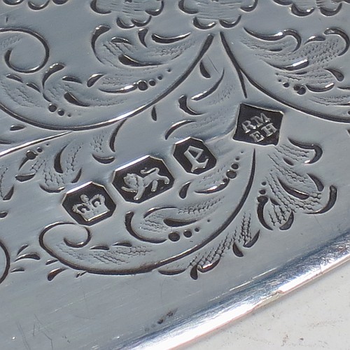 A very pretty Antique Victorian Sterling Silver crumb scoop, having a hand-engraved blade with floral and scroll decoration, and a plain bone handle with reeded ferrule. Made by Martin Hall and Co., of Sheffield in 1897. The dimensions of this fine hand-made antique silver crumb scoop are length 32 cms (12.5 inches), and width of blade 6 cms (2.25 inches).