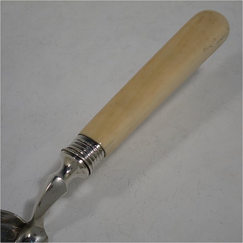 A very pretty Antique Victorian Sterling Silver crumb scoop, having a hand-engraved blade with floral and scroll decoration, and a plain bone handle with reeded ferrule. Made by Martin Hall and Co., of Sheffield in 1897. The dimensions of this fine hand-made antique silver crumb scoop are length 32 cms (12.5 inches), and width of blade 6 cms (2.25 inches).