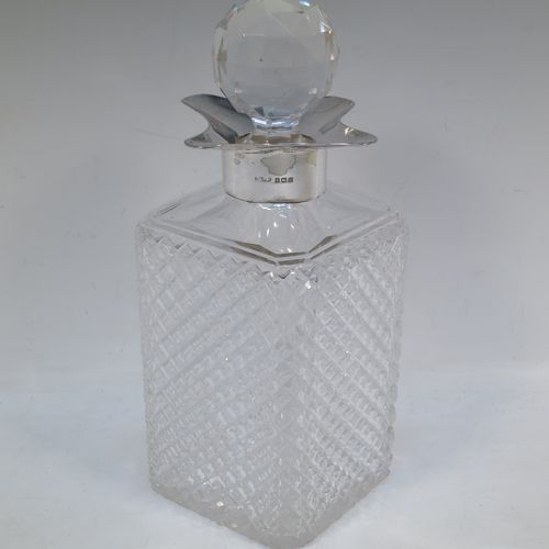 A very handsome Antique Sterling Silver and hand-cut crystal decanter, having a square cross-section body with straight sides and hand-cut hobnail decoration, a plain silver collar with four pouring spouts, and an original hand-cut stopper. Made by the Davies Brothers of Birmingham in 1913. The dimensions of this fine hand-made antique silver and crystal decanter are height 24 cms (9.5 inches), and 9.5 cms (3.75 inches) square.   