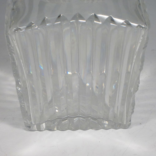 Sterling silver and hand-cut crystal decanter, having a square cross-section body with tapering sides, hand-cut fluted decoration, a silver collar with lip, and original fluted stopper. Made by Barker Brothers Ltd., of Birmingham in 1939. The dimensions of this fine silver and crystal decanter are height 23 cms (9 inches), and width 10 cms (4 inches).