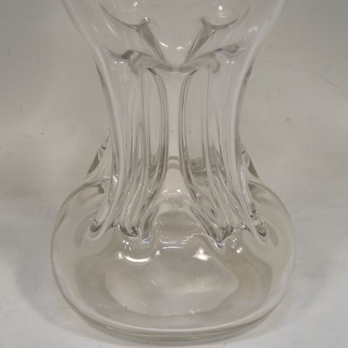 A very pretty Antique Victorian Sterling Silver and hand-cut crystal glug-glug decanter, having a plain body with four pinched and fluted central waists between, a plain round neck mount with four spouts, and a swirl fluted crystal stopper. This beautiful antique silver and crystal decanter was made by William Hammon of Chester in 1895. The dimensions of this fine hand-made antique silver and crystal glug glug decanter are height 21.5 cms (8.5 inches), and width at base 9 cms (3.5 inches).