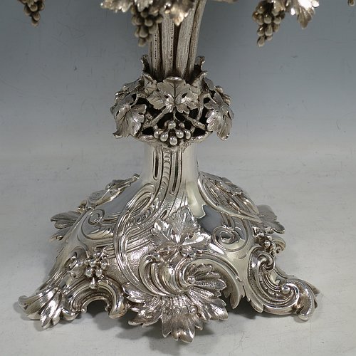 A very pretty Antique Victorian Sterling Silver compote or dessert stand with applied cast grape vine work, and sitting on a pedestal foot with hand-chased anthemion leaves, together with a hand-cut crystal bowl. Made by the Barnard Brothers of London in 1856. The dimensions of this fine hand-made antique silver and crystal dessert or compote stand are height 28 cms (11 inches), diameter of bowl 25.5 cms (10 inches), and it weighs approx. 1,273g (41 troy ounces).