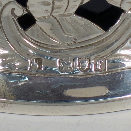 A handsome Antique Victorian Sterling silver miniature dish ring, in an Irish style, having a hand-pierced and chased body with with pastoral scenes, figures, animals, a vacant oval cartouche, and a blue-glass liner. Made by John and Frank Pairpoint of London in 1901. The dimensions of this fine hand-made antique miniature silver dish ring are height 5 cms (2 inches), diameter at base 11 cms (4.3 inches), and it weighs approx. 108g (3.5 troy ounces).