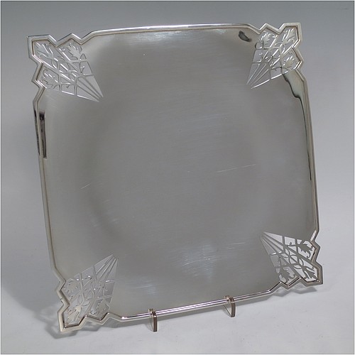 A Sterling Silver Art Deco very elegant style serving dish, having a square-shaped slightly concave body, with hand-pierced geometrical corners, and sitting on a pedestal foot. Made by Mappin and Webb of Sheffield in 1935. The dimensions of this fine hand-made sterling silver Art Deco dish are 23 cms (9 inches) square, height 2.5 cms (1 inch), and it weighs approx. 430g (13.9 troy ounces).   