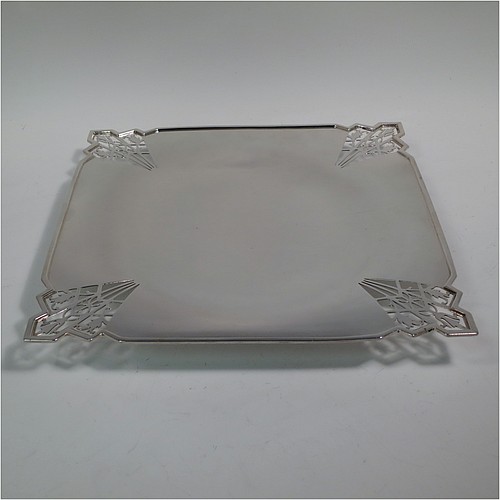 A Sterling Silver Art Deco very elegant style serving dish, having a square-shaped slightly concave body, with hand-pierced geometrical corners, and sitting on a pedestal foot. Made by Mappin and Webb of Sheffield in 1935. The dimensions of this fine hand-made sterling silver Art Deco dish are 23 cms (9 inches) square, height 2.5 cms (1 inch), and it weighs approx. 430g (13.9 troy ounces).