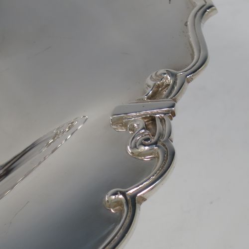 A handsome Sterling Silver Art Deco serving dish, having a panelled body, with an applied reed and scroll border, and sitting on a stepped pedestal foot. Made by Manoah Rhodes and Sons Ltd., of London in 1923. The dimensions of this fine hand-made silver Art Deco dish are length 26 cms (10.25 inches), width 20 cms (8 inches), height 7 cms (2.75 inches), and it weighs approx. 470g (15 troy ounces).