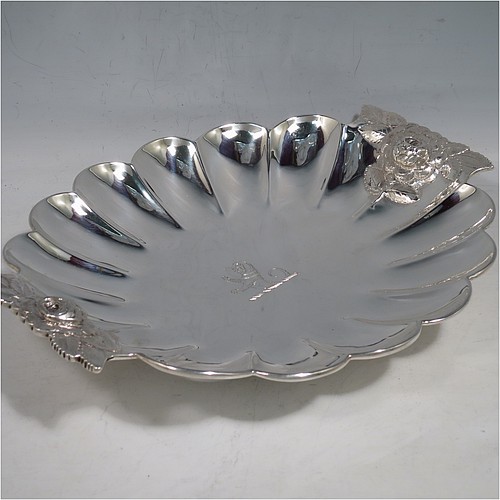 A very pretty Antique Victorian Sterling Silver strawberry dish, having an oval lobed body, with cast and hand-chased handles in the shape of roses, and sitting on a collet foot. Made by William Robert Smily of London in 1853. The dimensions of this fine hand-made antique strawberry table dish are length 24 cms (9.5 inches), width 19 cms ((7.5 inches), height 4 cms (1.5 inches), and it weighs approx. 316g (10.2 troy ounces).
	   