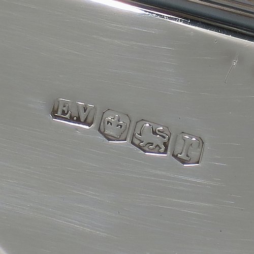 A Sterling Silver Art Deco dish, having an octagonal panelled body, with an applied ribbon & reed border together with two hand-cut bone handles, and sitting on a flat base. Made by Emile Viner of Sheffield in 1932. The dimensions of this fine hand-made Art Deco silver serving dish are length 30 cms (11.75 inches), width 18 cms (7 inches), height 3.5 cms (1.3 inches), and it weighs approx. 318g (10.3 troy ounces).