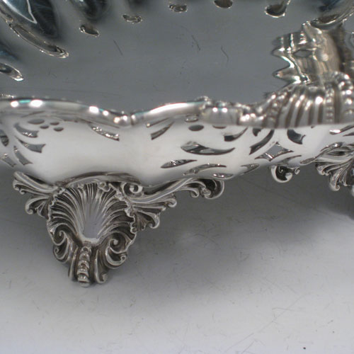 Antique Victorian sterling silver fine oval dish with fluted and hand-perced decoration, cast shell and foliate border, and cast shell feet. Made by Turner Bradbury of London in 1894. The dimensions of this fine hand-made table dish are height 11.5 cms (4.5 inches), length 34 cms (13.5 inches), width 24 cms (9.5 inches), and it weighs approx. 30 troy ounces (930g).