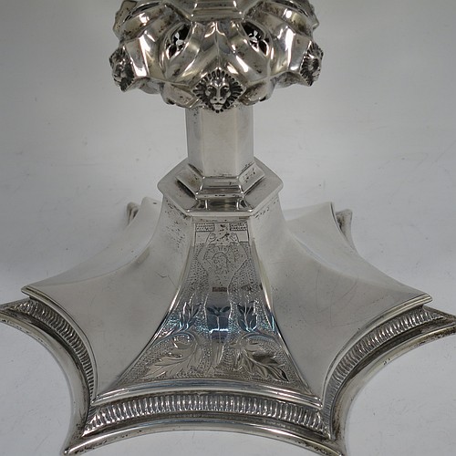 A large and heavy Antique Edwardian Sterling Silver altar chalice, having a plain round bellied cup, an octagonal column with middle baluster having hand-pierced decoration and applied leopards heads, and a spreading concave octagonal foot with a gadroon lower borer. Made by Frederick Wray of London in 1910. The dimensions of this fine hand-made antique silver altar chalice are height 20 cms (8 inches), diameter of cup 12cms (4.75 inches), across foot 16 cms (6.3 inches), and it weighs approx. 584g (18.8 troy ounces).