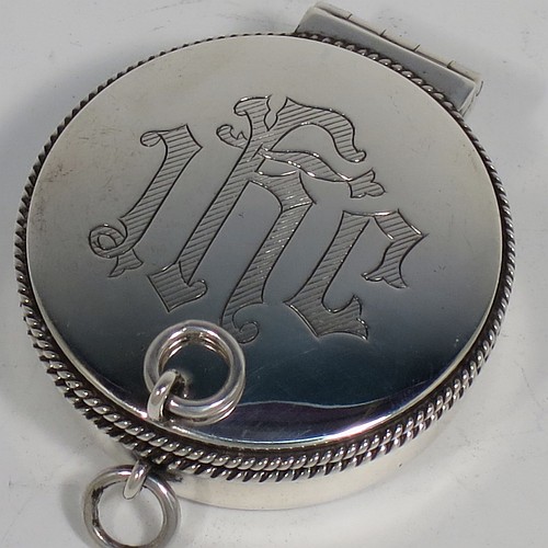 A handsome Sterling Silver Pyx box, having a plain round body with applied rope-twist borders, a hinged lid with a hand-engraved Christogram, a gold-gilt interior, and with a pair of ring handles. Made by B. & W. Ltd., of London in 1960. The dimensions of this fine hand-made silver Pyx box are diameter 5 cms (2 inches), depth 2 cms (0.5 inches), and it weighs approx. 52g (1.7 troy ounces).